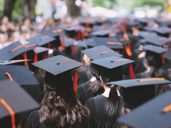 group of students wearing graduation gowns and caps